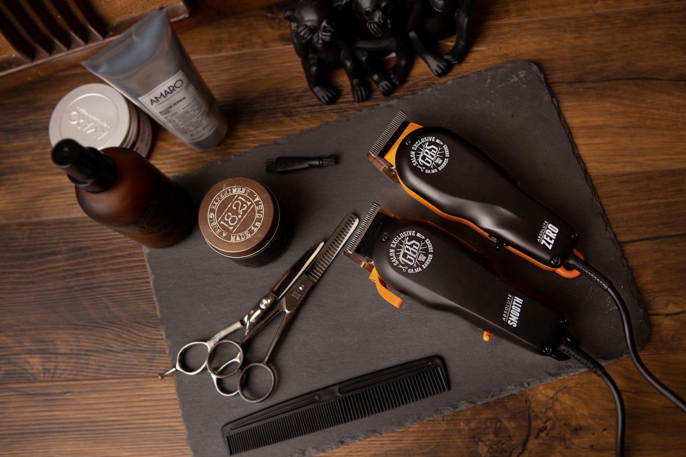Barbering tools laid out on a leather roll